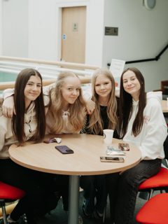 A group chatting around a table
