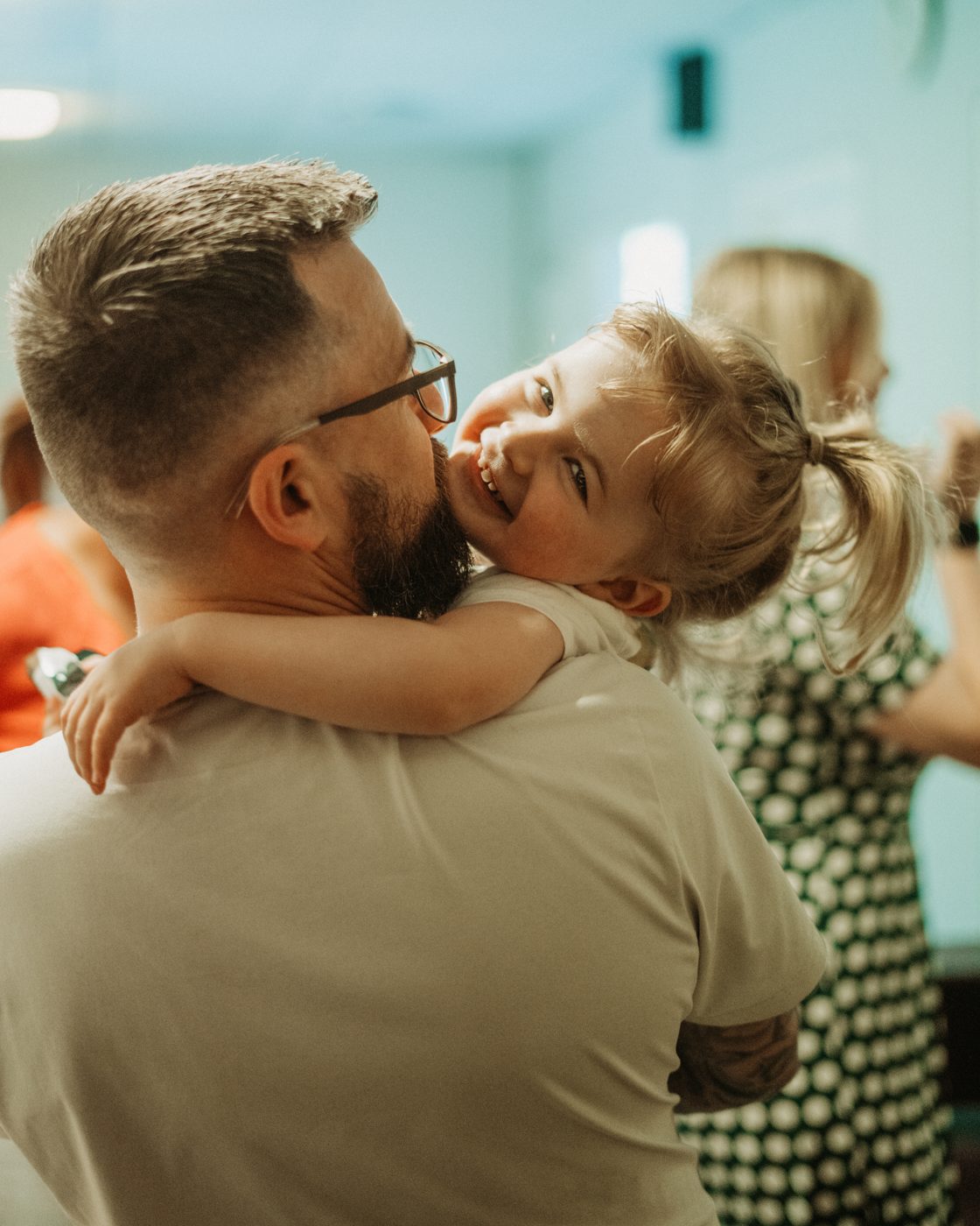 A dad hugging his daughter at church