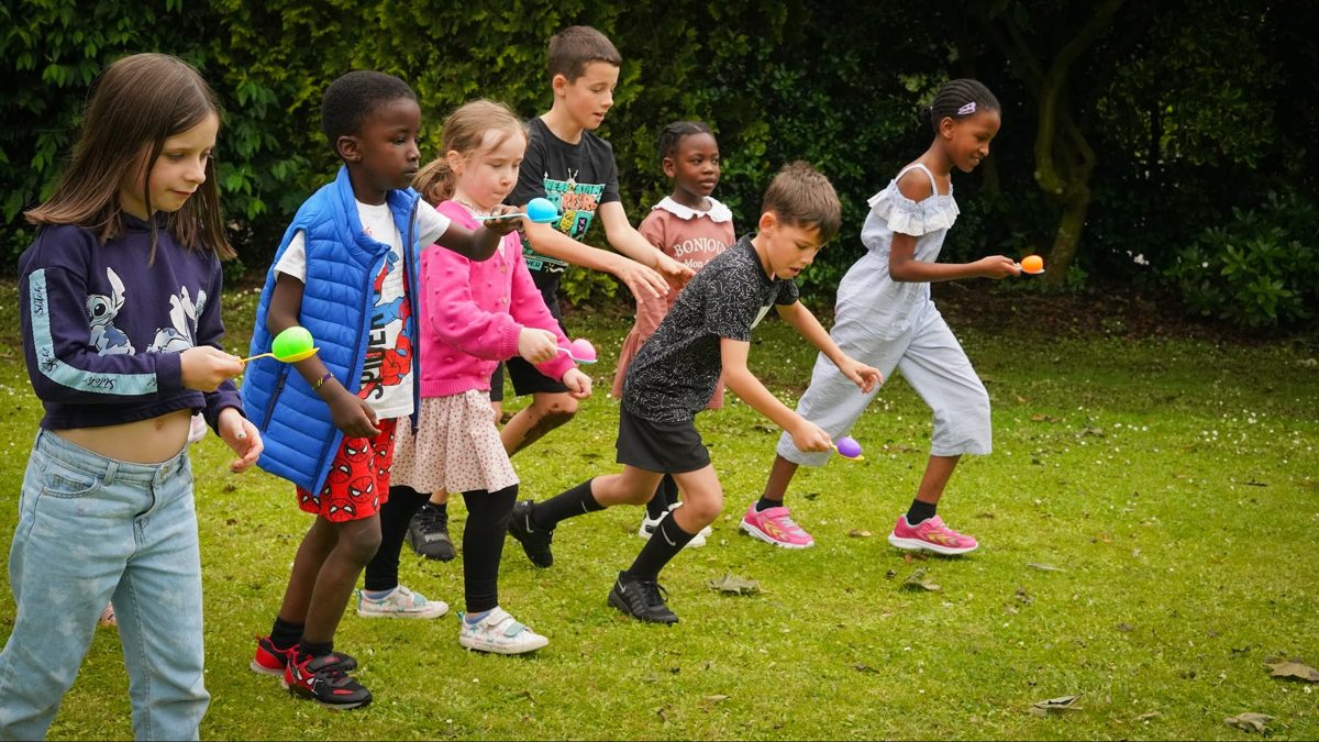 Kids racing in the park at a church fun day